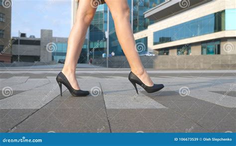 Female Legs In High Heels Shoes Walking In The Urban Street Feet Of